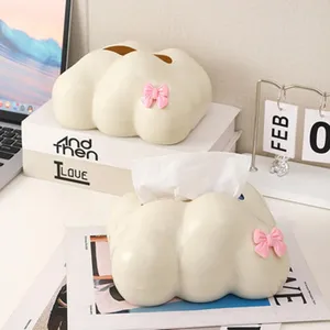 Detailed view of a cute cloud-shaped tissue box featuring a charming pink bow.