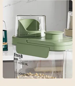 Close-up of green airtight cereal container lid with integrated measuring cup and scale.