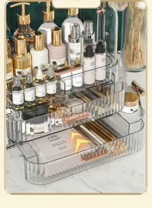 Detail of transparent storage drawers showing skincare masks and makeup brushes