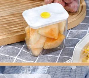 Close-up view of a transparent airtight plastic food container filled with fresh cut melon