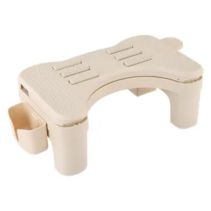 Ergonomic beige plastic footrest with non-slip texture and side storage for office use