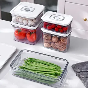 Boîtes de conservation sous vide avec couvercles blancs sur un comptoir de cuisine