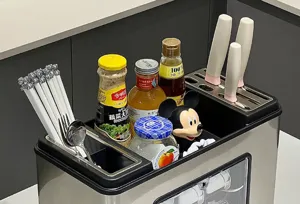 Detail view of a stainless steel kitchen rack organizing seasoning bottles and knives.