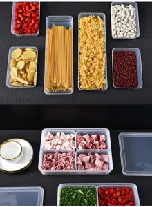 Transparent plastic refrigerator storage boxes with divided compartments for food prep