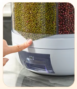 Vue détaillée du bouton de distribution et du tiroir d'un bac à grains rotatif.