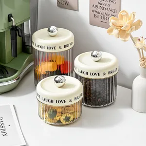 Transparent fluted airtight storage jar set with cream lids and silver knobs