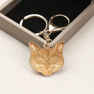 Vintage gold-plated fox mask keychain charm, elegant metal bag accessory decoration