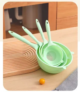 Detailed view of the 4-piece mint green kitchen strainer set for washing rice and vegetables