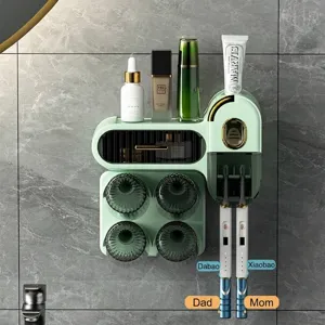 Wall-mounted green toothbrush holder set with automatic toothpaste dispenser