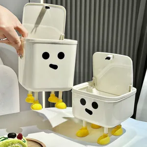 Cute white desktop trash can with lid and cartoon face design with yellow legs