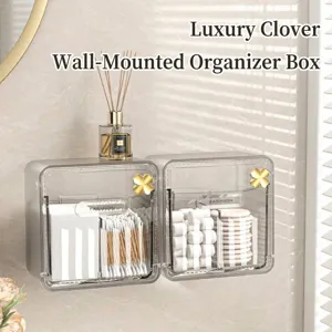Organizador cosmético transparente de pared con detalles de trébol dorado.