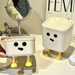 Cute desktop storage box with lid and funny face design shown in a home office setting
