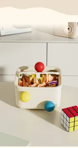 Detailed view of creative desktop storage box with colorful spherical knobs in a cozy home setting