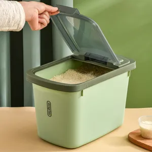 Sealed household rice storage bucket with transparent flip lid and measuring cup