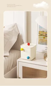 Creative cream desktop storage box with colorful knobs shown in a bedroom setting