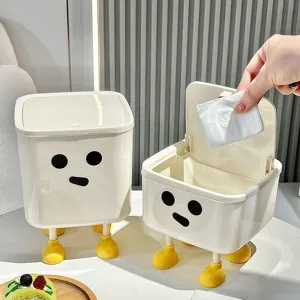 Cute creative character desktop trash can with lid and legs for home office storage.