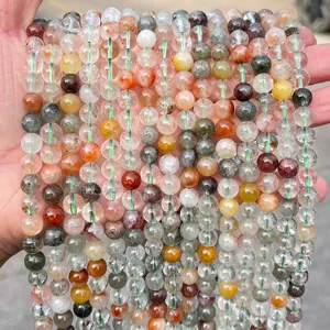 Close-up of natural phantom quartz beads showing colorful mineral inclusions for DIY.