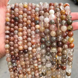 Macro detail of natural multi-color phantom quartz crystal beads for DIY jewelry.