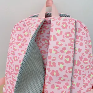 Close-up detail of breathable mesh shoulder straps on this pink leopard print backpack