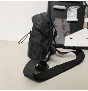 Side view of black camouflage chest bag featuring a durable and adjustable shoulder strap
