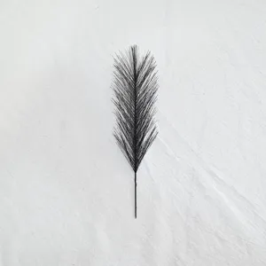 Detailed close-up of a black artificial feather stem, ideal for creative DIY floral arrangements.