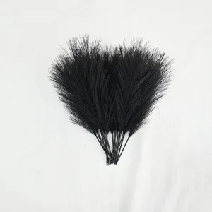 Close-up detail of black artificial reed feather floral decor for wedding and holiday window display.