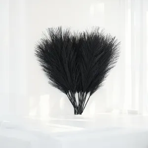 Black artificial pampas grass feather floral detail closeup for wedding home decor.