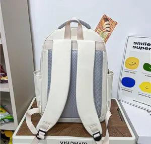 Detailed view of the casual beige backpack back, showing breathable mesh straps and sturdy buckle.