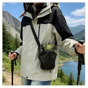 Macro detail of a waterproof outdoor shoulder phone pouch shown during a hiking trip