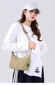 Stylish nylon crossbody bag for women, perfect for daily commuting and casual wear.