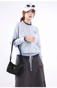 Stylish black nylon crossbody bag for women shown on a model, versatile for daily commute.