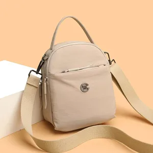 Bolso bandolera compacto de tela oxford para mujer bolso de hombro mini con bolsillos
