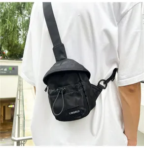 Detailed view of stylish black camouflage chest bag for outdoor casual sports on model