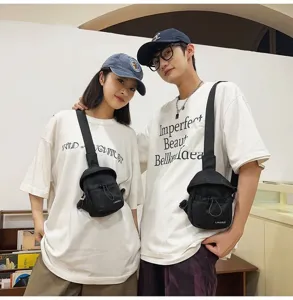 Couple wearing stylish black outdoor crossbody chest bags for casual and sports use