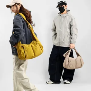 Large capacity waterproof nylon crossbody bag, casual dumpling shoulder bag for daily use.