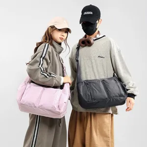 Large capacity waterproof nylon crossbody bag, unisex casual dumpling shoulder bag with pockets.
