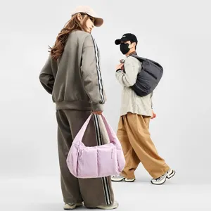 Large capacity waterproof puffer shoulder bag, trendy crossbody dumpling bag for daily use.