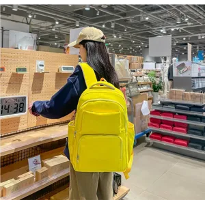Stylish casual yellow backpack with large capacity for travel, school, and daily commute.