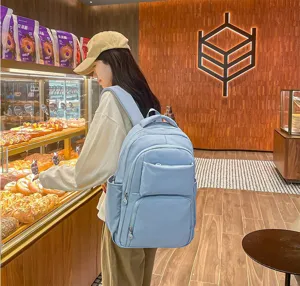 Detailed view of the light blue casual backpack in a store setting, showing daily use.