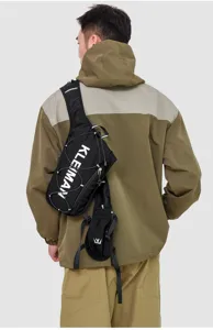 Detailed back view of a black lightweight breathable marathon running vest bag on a model