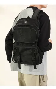 Detail view of the black breathable mesh backpack, showing large capacity and multi-pocket.
