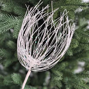 Close-up of a sparkling pink glitter fireworks-shaped branch for Christmas tree decor