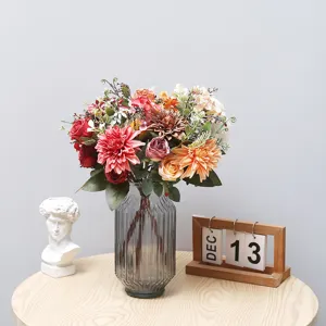 Artificial dahlia rose flower bouquet in grey glass vase for home decor and wedding photography