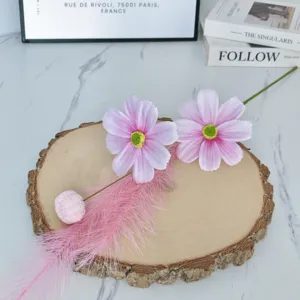 Artificial pink cosmos flower decor on wood slice, floral arrangement for home table setting.