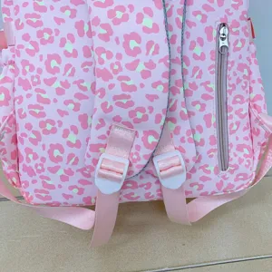 Detailed view of pink leopard print backpack with adjustable shoulder straps and zipper