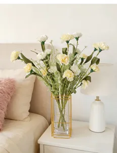 Artificial carnation bouquet detail shot showing realistic floral arrangement in glass vase.