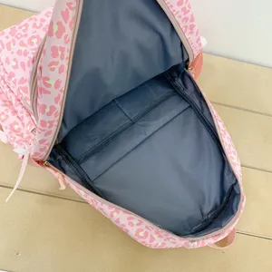 Internal view showing compartments of pink leopard print large capacity backpack