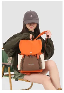 Detail view of the stylish color-blocked backpack, showcasing its large capacity and durable design.