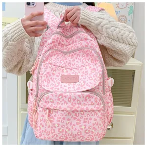 Pink leopard print backpack featuring large capacity and a stylish brand logo patch for school