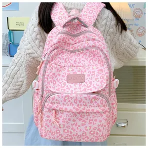 Back view of a trendy pink leopard print large capacity backpack for school and travel